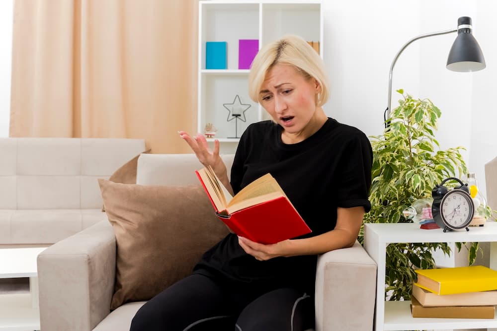 An adult with ADHD reading aloud to improve concentration and retention.
