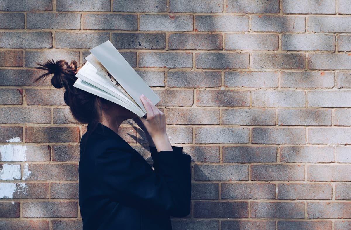 An adult showing the struggles and difficulties of ADHD reading.
